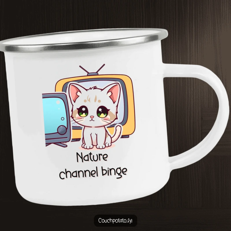 Funny kitten with wide, staring eyes captivated by a television screen, featured on a durable camping mug, for humorous outdoor viewing.