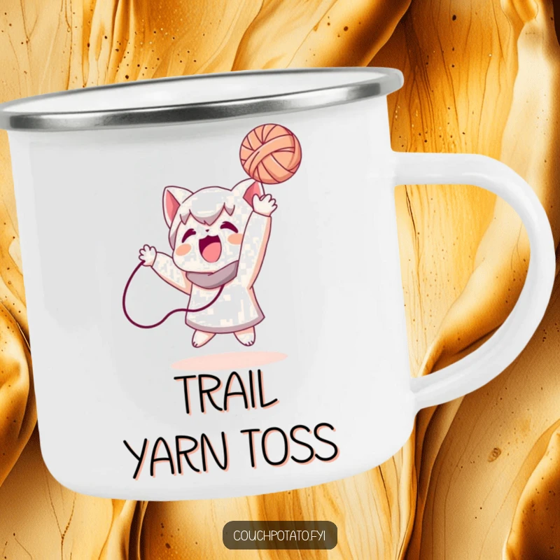 Funny, durable camping mug showing a character playfully tossing a ball of yarn, perfect for enjoying beverages outdoors with a grin.