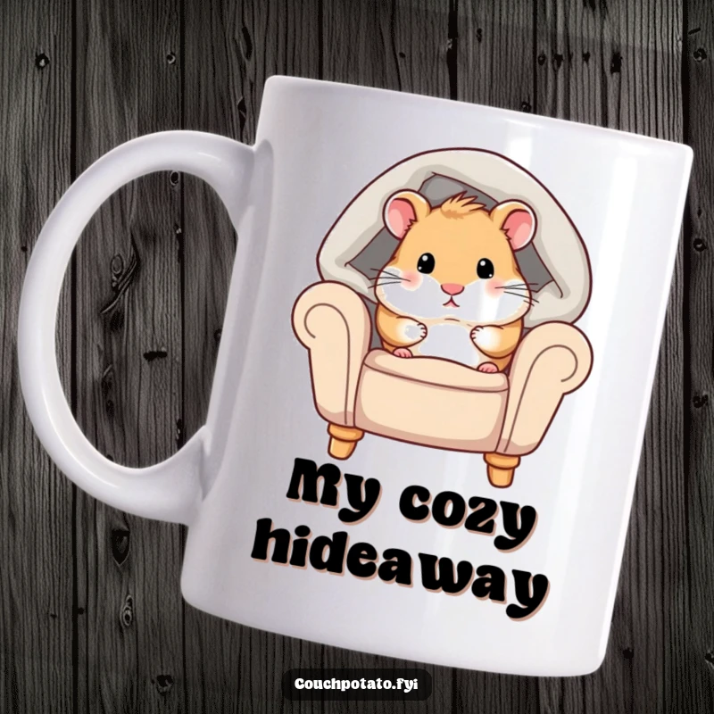 Funny hamster mug with a chubby hamster peeking from under a cozy blanket on an armchair, conveying ultimate comfort and relaxation.