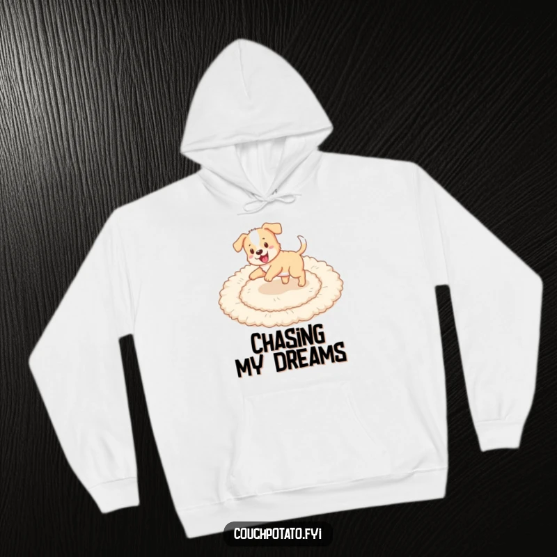 Funny puppy chasing its tail in circles on a fluffy rug, featured on a warm and cozy hoodie.