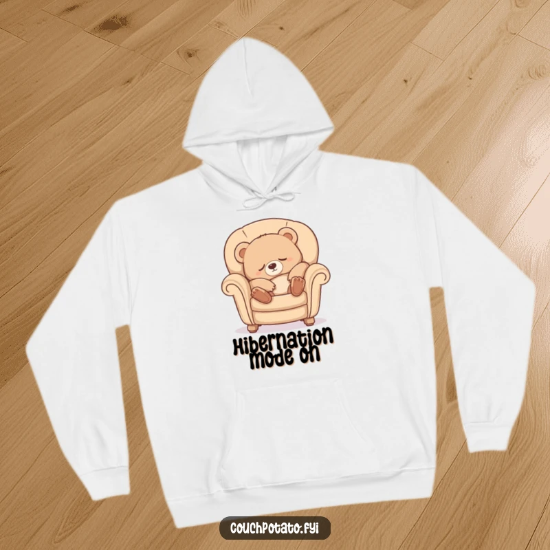 Funny Sleepy Bear Hoodie showing a cute bear cub luxuriously stretching and sinking into a comfy armchair, perfect for cozy days.