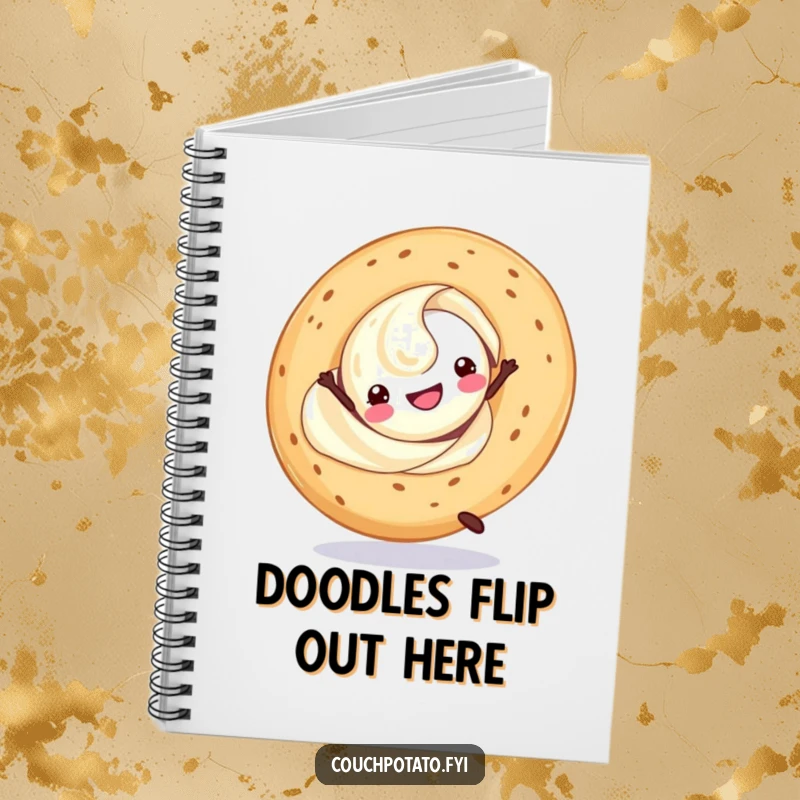 Funny cream cheese swirl doing a cartwheel with a bagel, on the cover of a notebook for writing and planning.