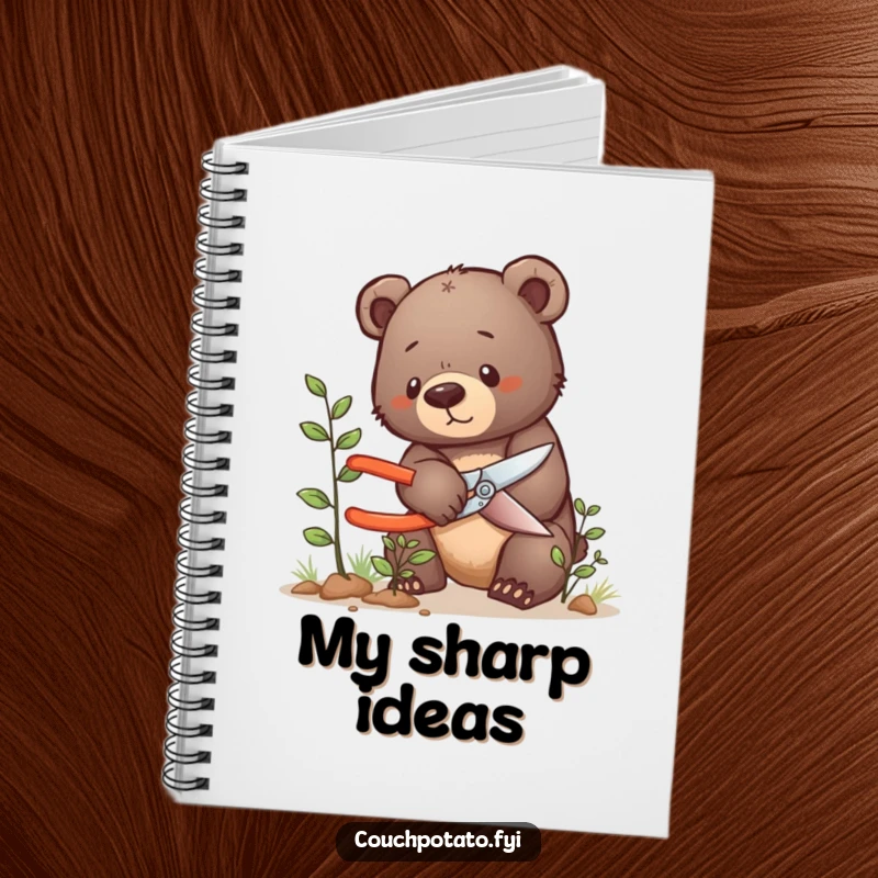 Funny bear cub notebook, a determined bear cub carefully prunes a tiny bush, ideal for gardening notes.