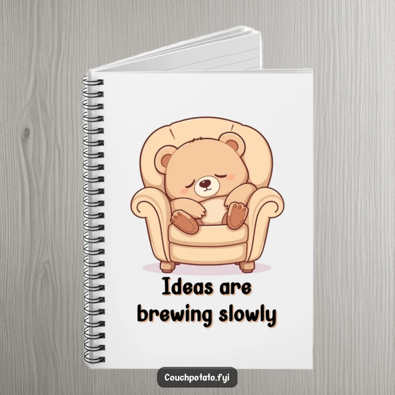 Funny Sleepy Bear Notebook with a cute bear cub luxuriously stretching into a comfy armchair, ideal for note-taking bliss.