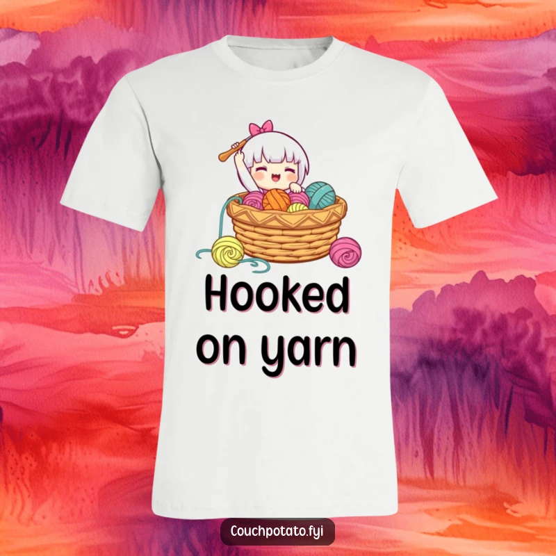 Funny t-shirt showing a character gleefully lowering a crochet hook into a basket brimming with yarn, celebrating the fun of making.