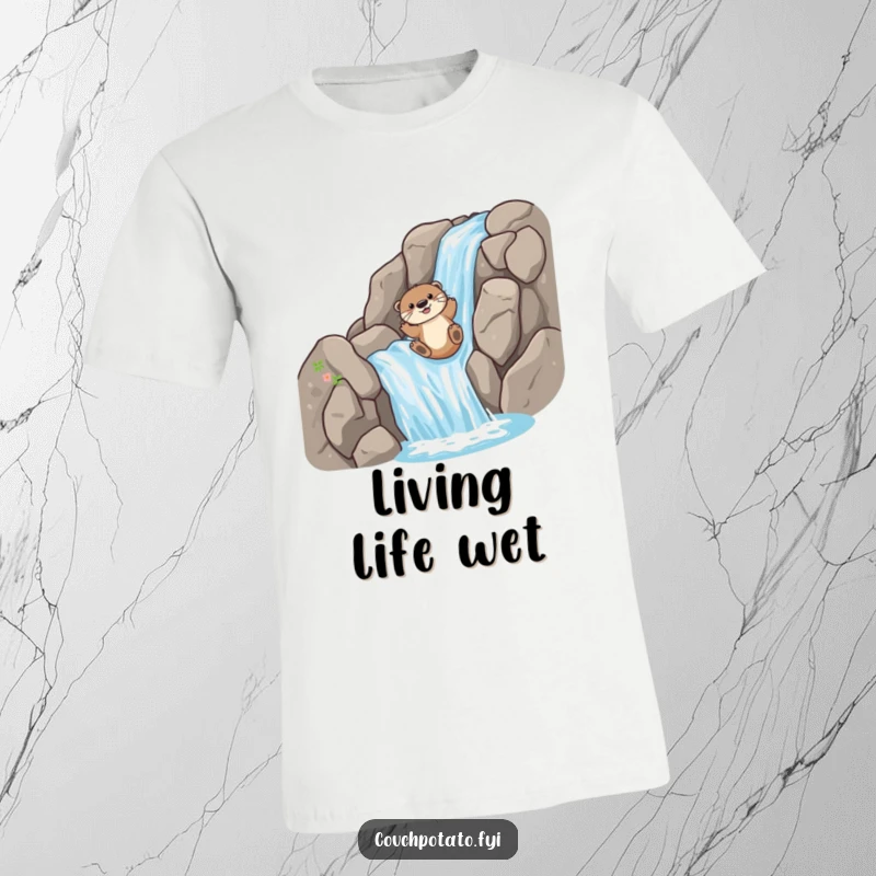 Funny T-Shirt: A happy otter slides down a rocky waterfall, embodying playful adventure and aquatic fun.
