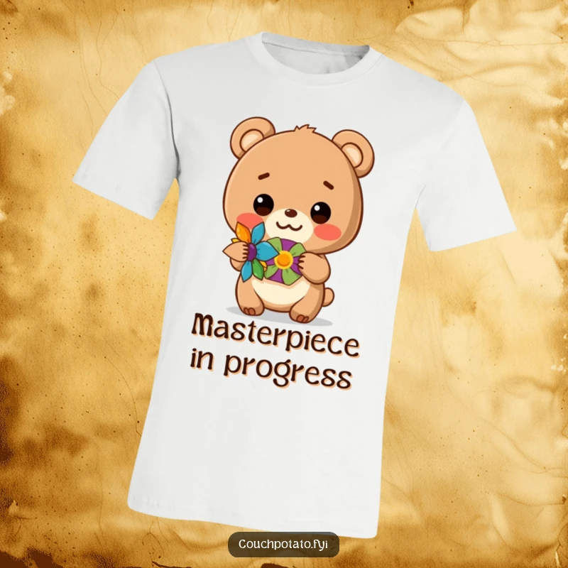 Funny t-shirt showcasing a beaming bear cub proudly presenting a vibrant DIY craft, perfect for proud makers.
