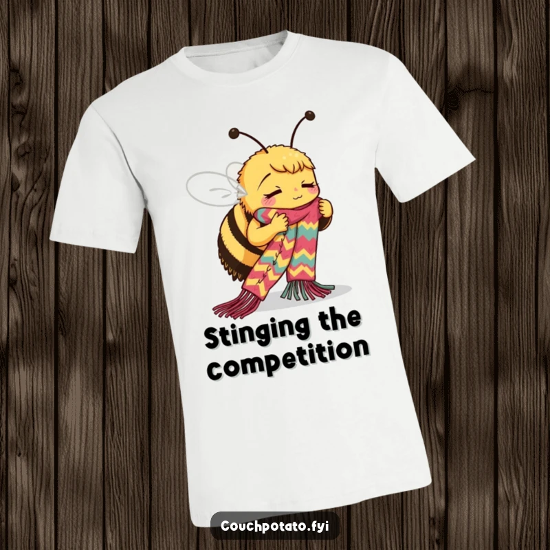 Funny Bee Knitting T-Shirt: A busy bee intently knits a lengthy, vibrant scarf, showcasing its impressive crafting skills.