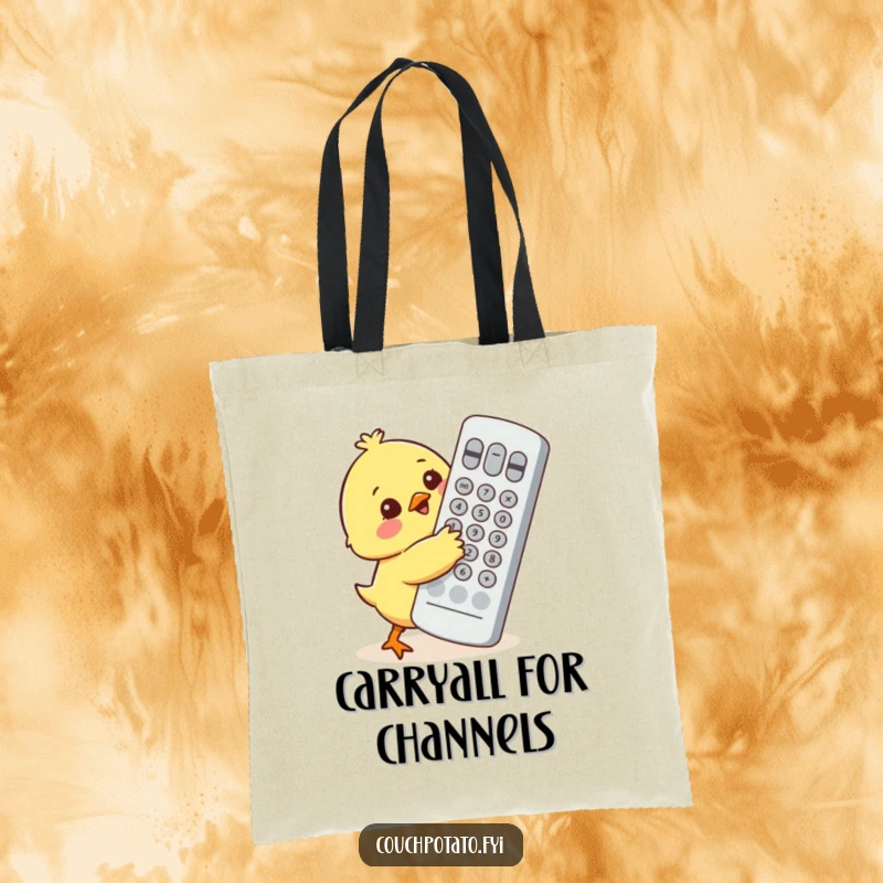 Funny chick character adorably attempting to hug a comically huge TV remote control on a reusable tote bag.