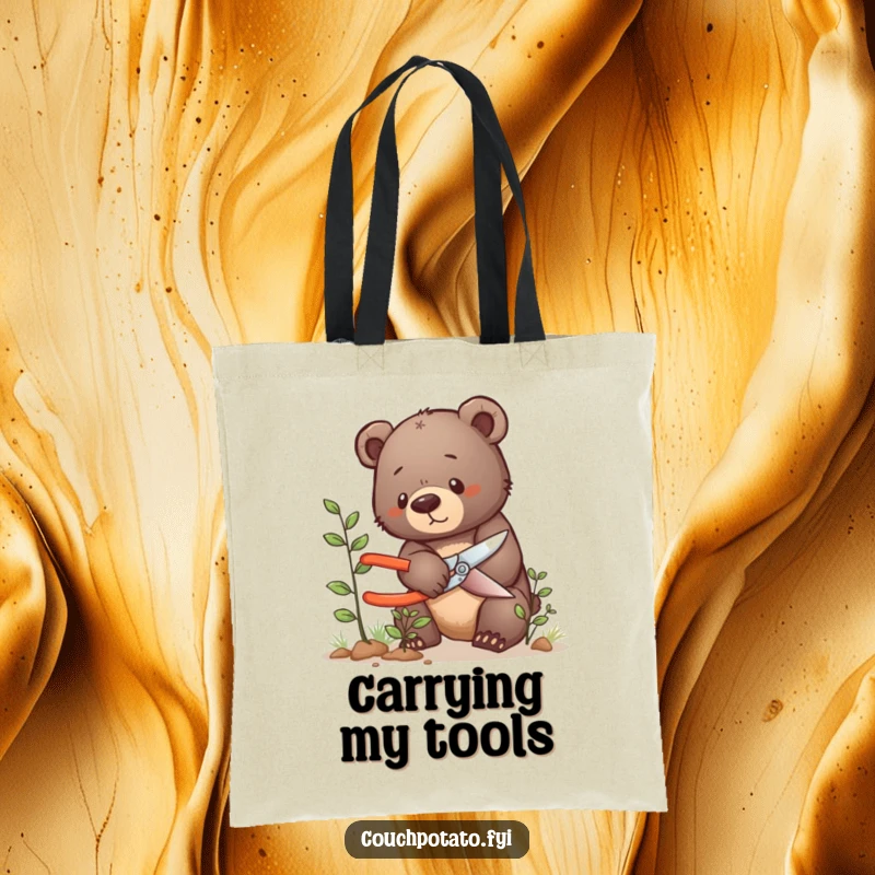Funny bear cub tote bag, a determined bear cub carefully prunes a tiny bush, perfect for carrying garden supplies.