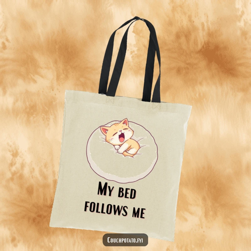Funny sleepy cat tote bag featuring a cat curled on a giant pillow, yawning widely, perfect for carrying daily essentials.