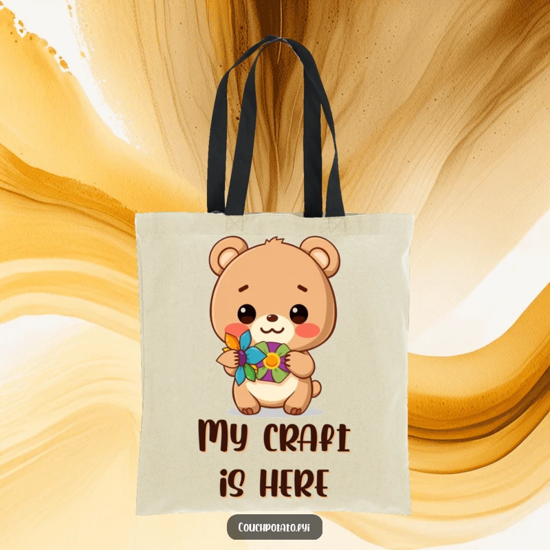 Funny tote bag with a cheerful bear cub displaying a handmade craft, ideal for carrying art supplies.