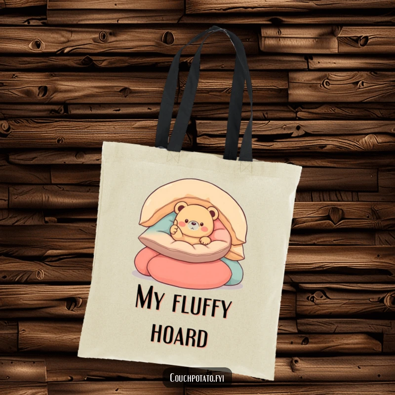 Funny round bear tote bag showcasing a small, round bear nestled in cushions, giving a thumbs up, perfect for everyday use.