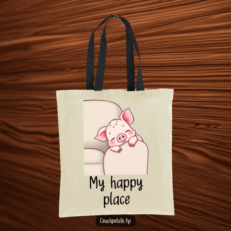 Funny cheerful piglet tote bag with a piglet draped over a couch armrest, wiggling toes, perfect for daily use.